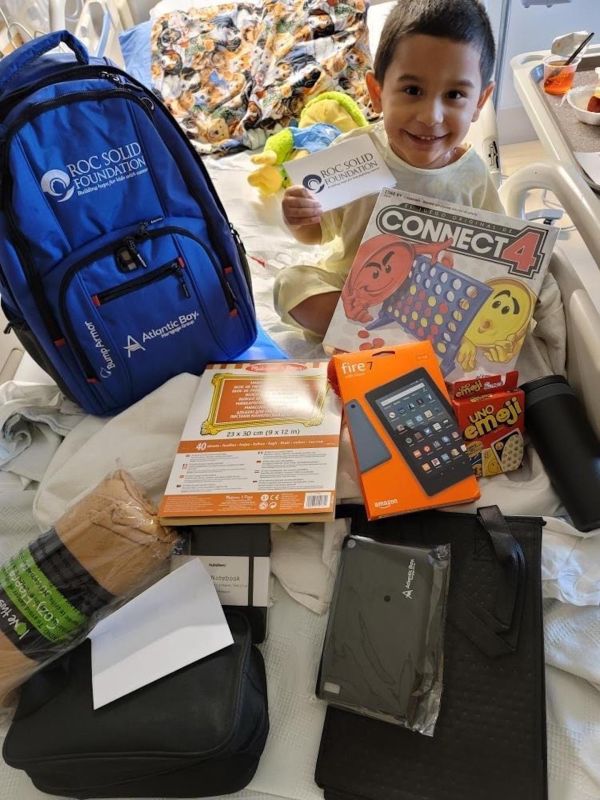 Carson Holds Up Items from Ready Bag