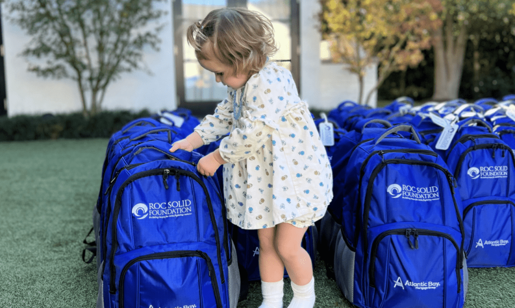 Olive showing the world what hope looks like next to a Roc Solid Ready bag.