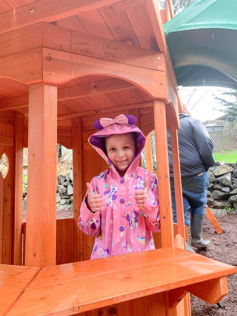 Pediatric cancer fighter Eleanor on her Roc Solid playset