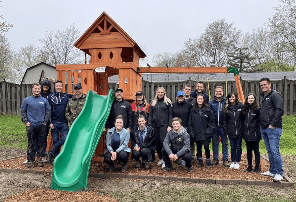 The Kaulig Giving team posing next to the completed playset