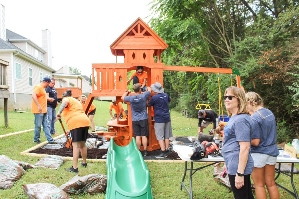 The Nashville Amazon volunteer team hard at work building Dylan's playset.