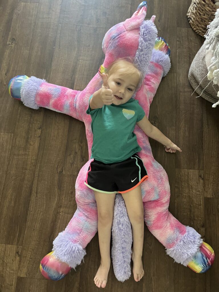 Tessa with her unicorn