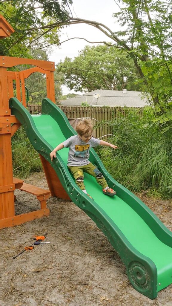 Jacob is all smiles going down his slide on his new playset for the first time! 