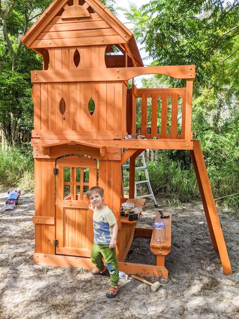 Jacob showing off his new playset.  Jacob likes to pretend the house of the playset is a jail and captures his mama and papa bear or his dog here.