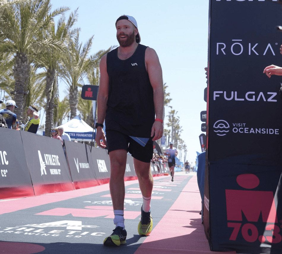 Chris Wilkerson crossing the Ironman finish line.